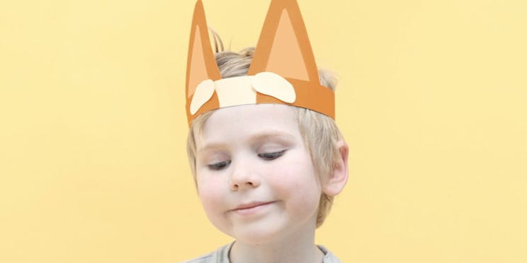 Image of a child wearing a bingo paper hat for book week. 