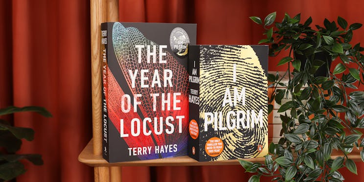 The Year of the Locust and I Am Pilgrim next to each other on a bookshelf. 
