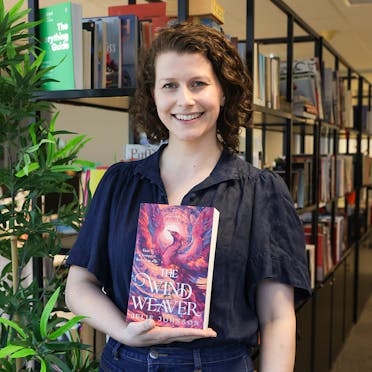 Adelaide holding The Wind Weaver.