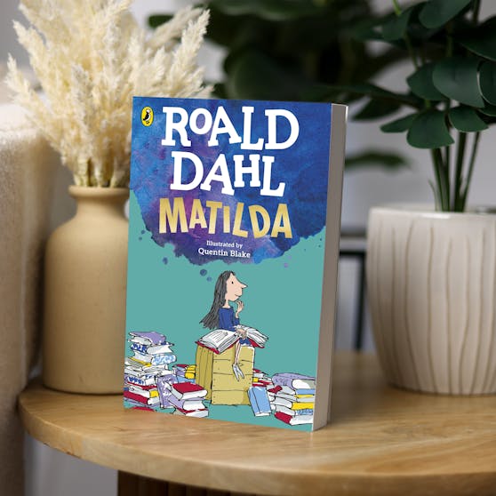 Matilda by Roald Dahl sitting on a side table. 