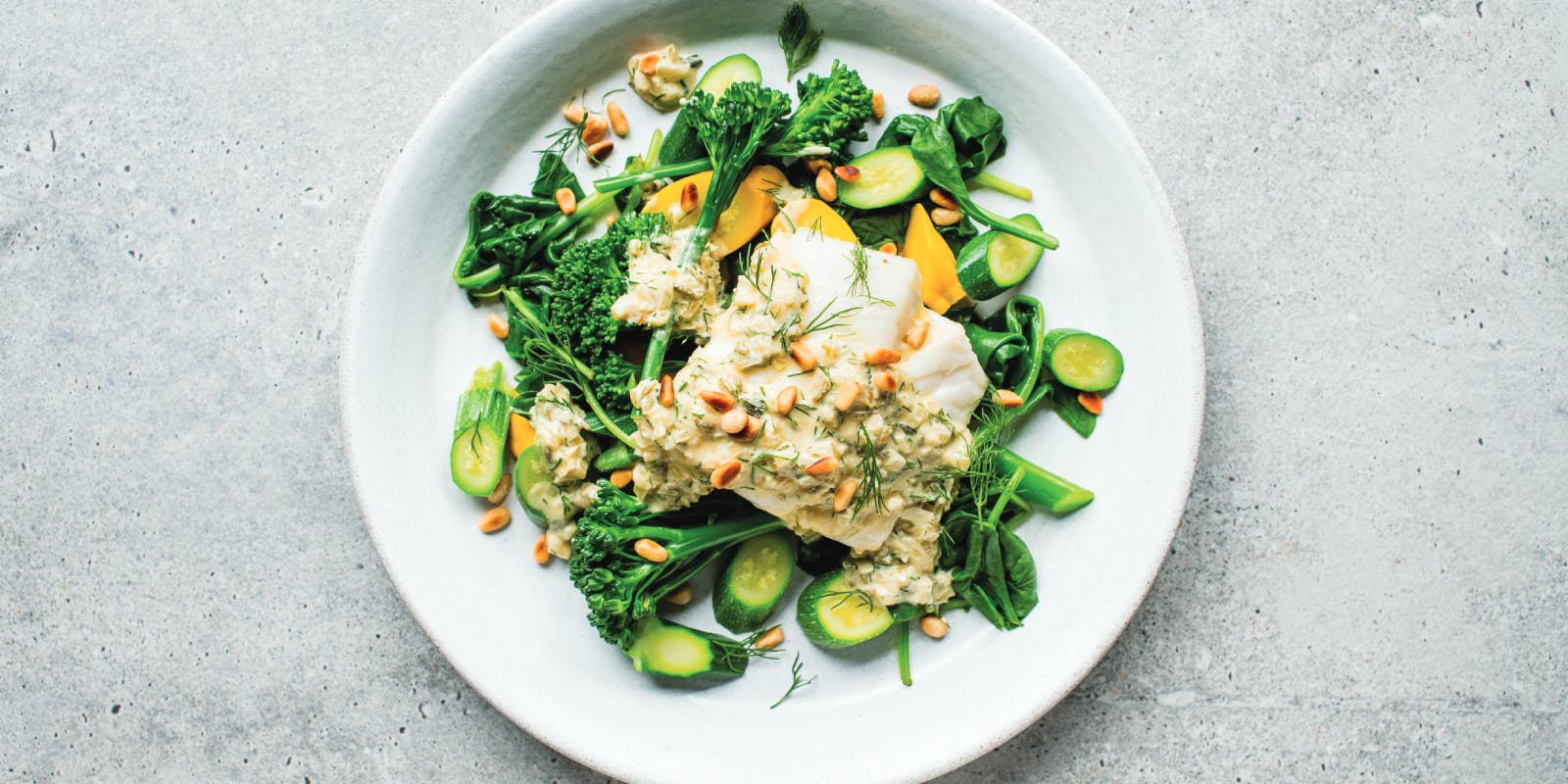 Cod with tahini, pine nuts and spinach